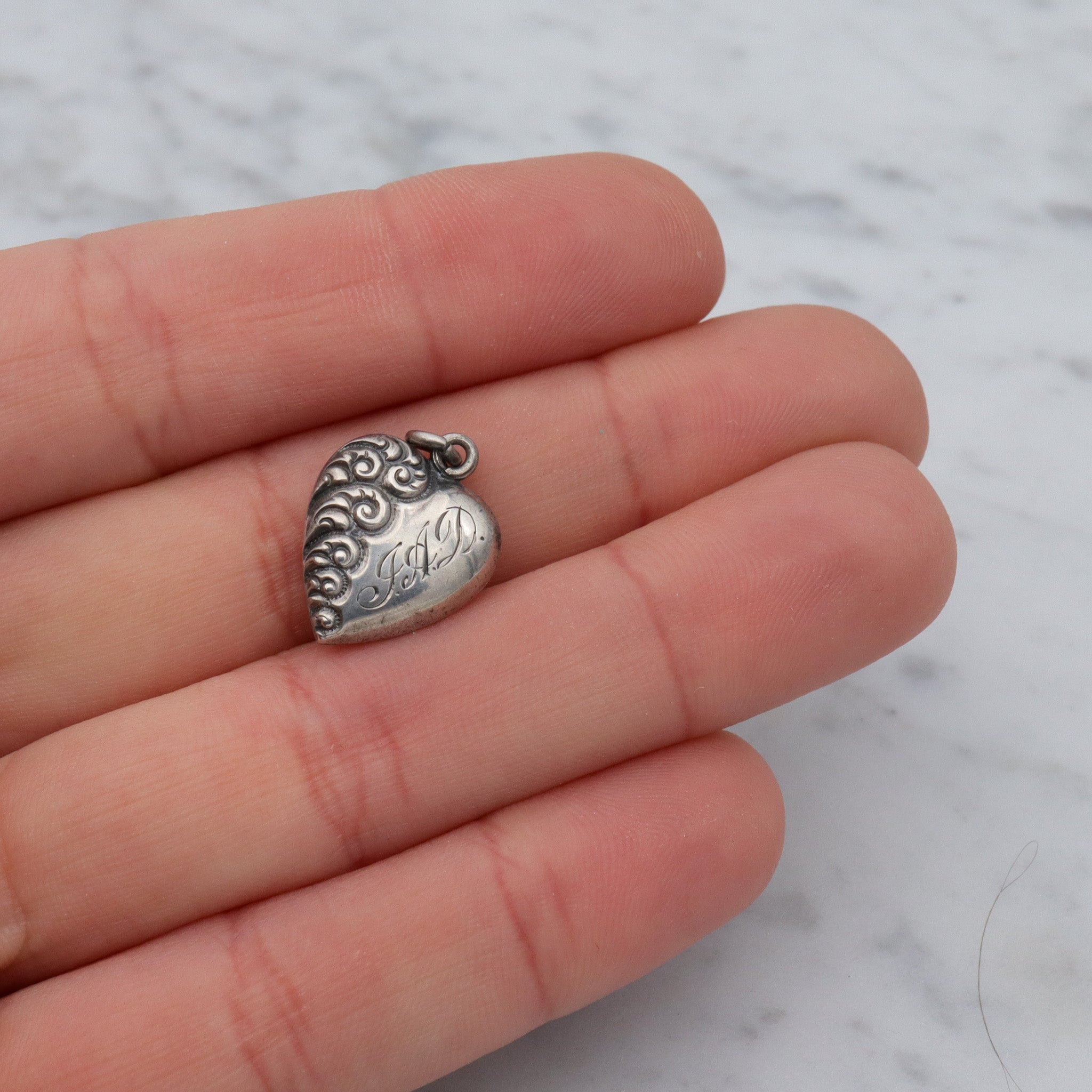 Antique Victorian repousse puffy heart charm pendant with monogram “J.A.D”